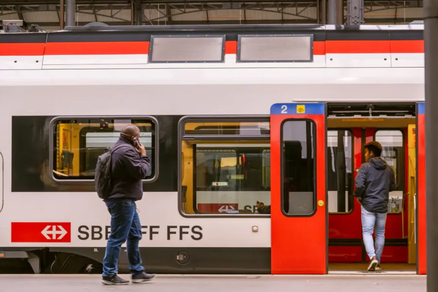 Travelers boarding an SBB train at the Lucerne railway station in Switzerland. – Why Night Trains in Europe Are Booming in 2026