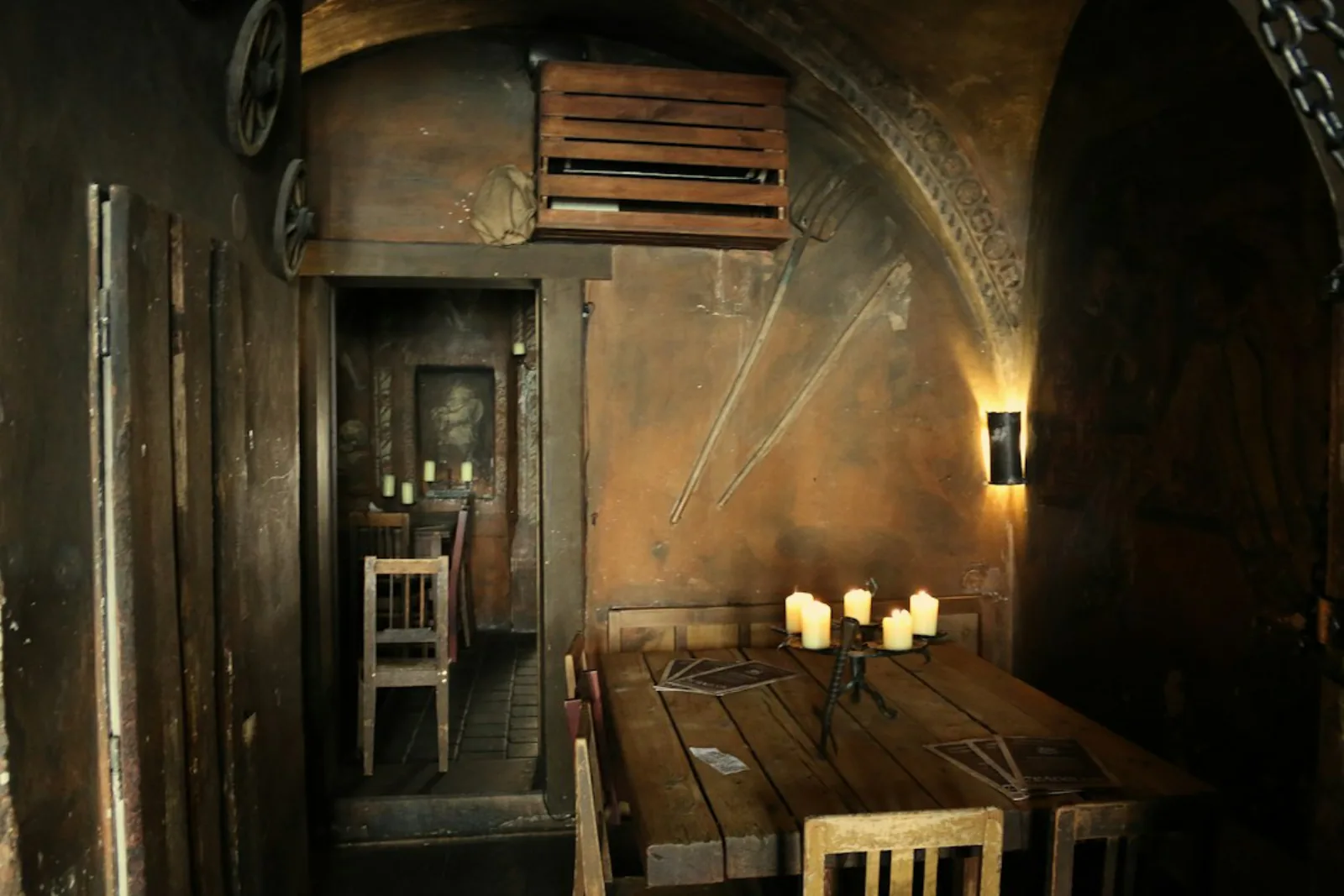 A room with a wooden table and chairs – Which Prague Bars Are Worth Your Evening?